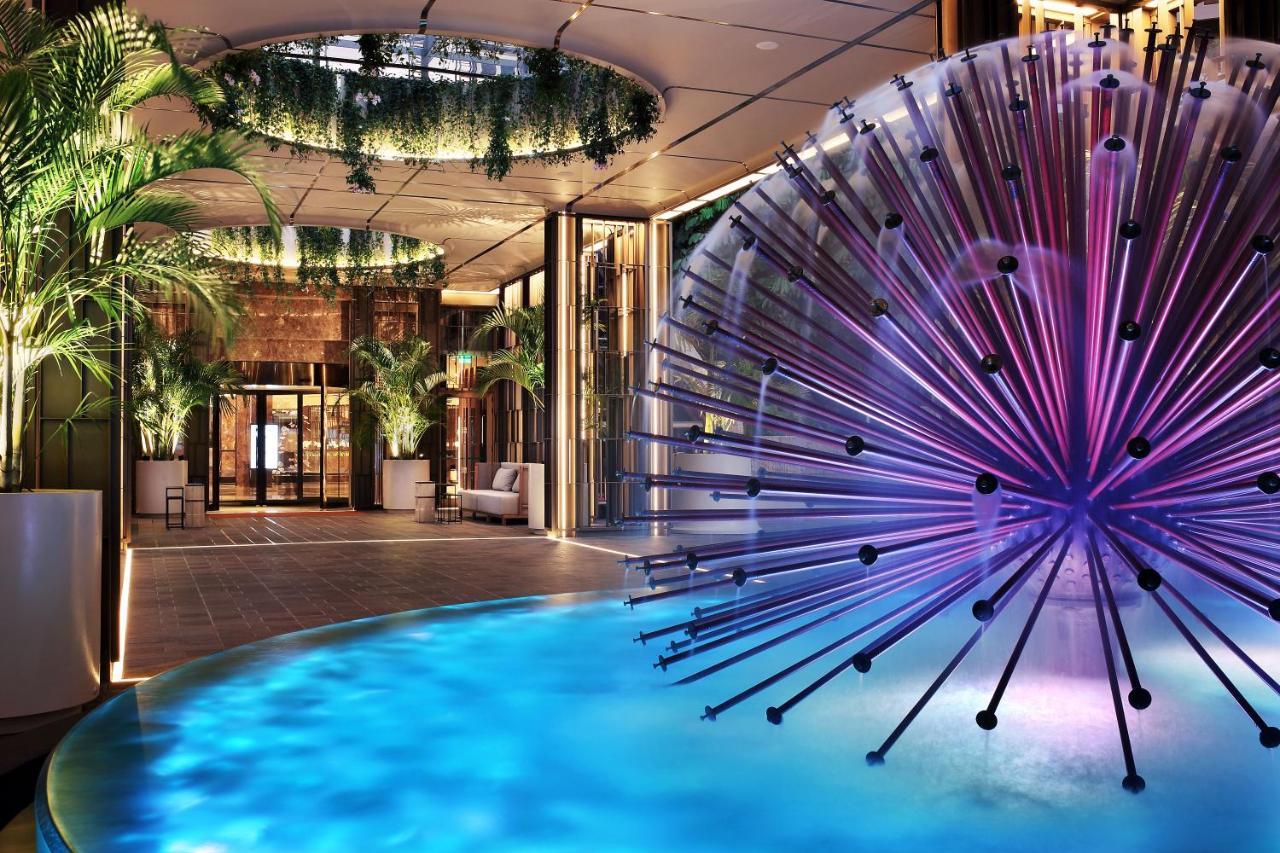Four Seasons Hotel Agios Tychonas Exterior foto The pool at the Mandarin Oriental, Munich