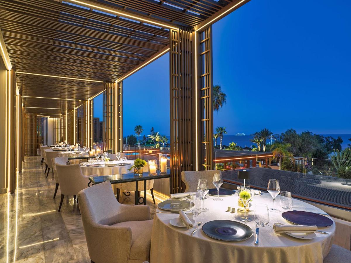 Four Seasons Hotel Agios Tychonas Exterior foto The restaurant at the hotel