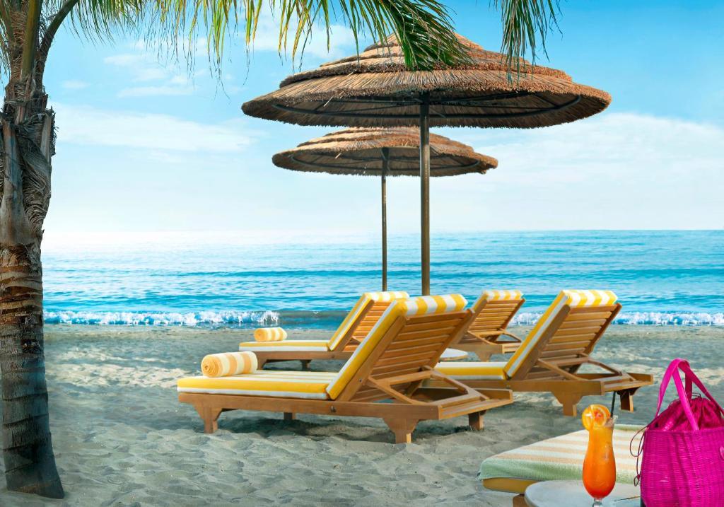 Four Seasons Hotel Agios Tychonas Cameră foto Beach chairs